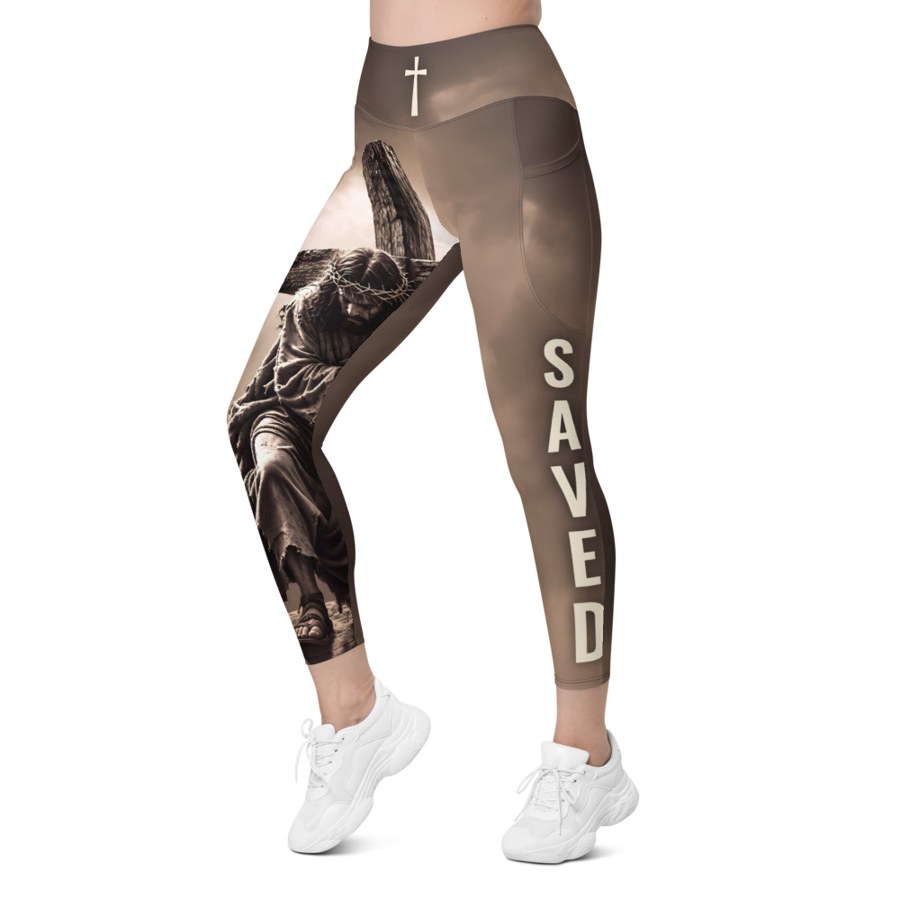 SAVED Sky leggings — the scene down one leg, SAVED down the other